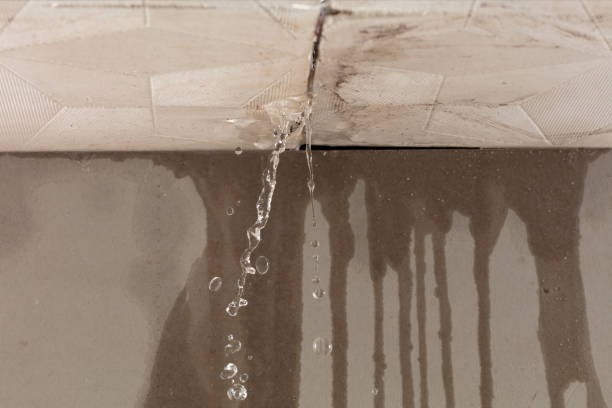 Professional Flood Damage Cleanup technician working in Pembroke, MA